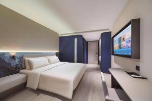 TV a/nebo společenská místnost v ubytování Atour Light Hotel Nanjing Station Hongshan Zoo
