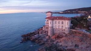 an aerial view of a castle on a cliff in the water at Suite al Castello Boccale Terrazza sul Mare in Livorno