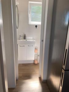 a small bathroom with a sink and a mirror at Apartment Mrkić in Biograd na Moru +115 photos