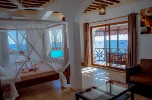 Postel nebo postele na pokoji v ubytování Langi Langi Beach Bungalows