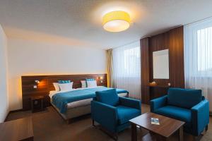 Posteľ alebo postele v izbe v ubytovaní Hotel Metropol