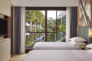 Courtyard by Marriott Bali Seminyak Resort客房内的一张或多张床位
