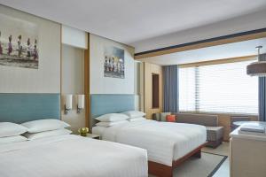 Courtyard by Marriott Bali Seminyak Resort客房内的一张或多张床位