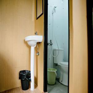 a bathroom with a sink and a toilet at Great Panorama Lodge and Camp by MHM in Lembang
