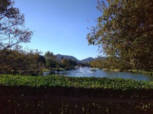 a view of a river with a fountain in the distance at Modern Large 5 bedroom Villa in Pecanwood Golf Estate in Hartbeespoort