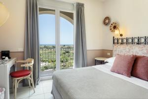 A bed or beds in a room at Mangia's Selinunte Resort