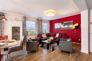 a living room with a couch and a table at Ferienhaus Bella Vita in Walkenried +19 photos