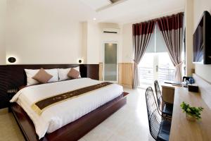 Katil atau katil-katil dalam bilik di Khanh Lai Hotel 慶來旅店