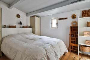 En eller flere senge i et værelse på Jolie maison pour 7 - 300 m de la plage - Dunes