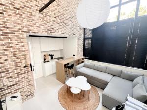 a living room with a couch and a table at Siar Rooms in Durrës