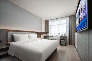 TV a/nebo společenská místnost v ubytování Atour Liight Hotel Liaocheng Dongchang Lake