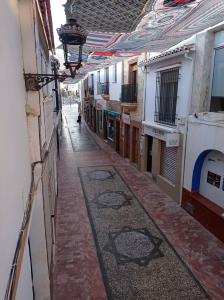 an empty alley way in an old building at Casa de la Ermita in Alhaurín de la Torre