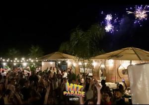a large crowd of people standing under umbrellas at night at Casa Vacanze San Giacomo Comfort Apartment in Centro a pochi passi dal Mare in Barletta