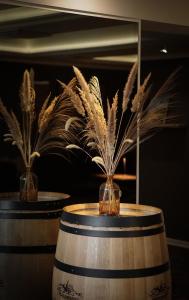 two barrels with plants in them in a room at Frederiksdal Sinatur Hotel & Konference in Kongens Lyngby