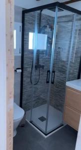 a bathroom with a shower and a toilet at Teletrabajo en paz o fin de semana en el pueblo in Moros +29 photos