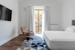 Letto o letti in una camera di Dome Hotel