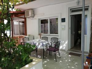 a table and chairs on the patio of a house at Lina in Gradac