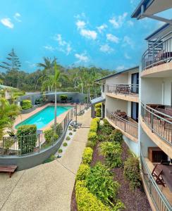 an aerial view of an apartment complex with a swimming pool at Beaches Holiday Resort in Port Macquarie