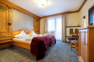 Voodi või voodid majutusasutuse Hotel Alpenrose toas