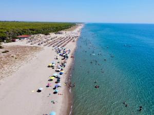 an overhead view of a beach with people in the water at Casa La Salsa in Pisticci