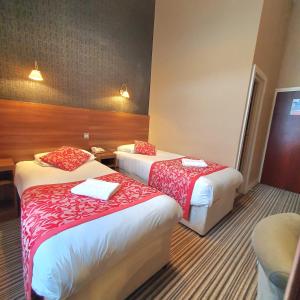 Postel nebo postele na pokoji v ubytování Oliver Hotel