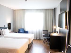 TV a/nebo společenská místnost v ubytování Grand Mercure Sao Paulo Vila Olimpia