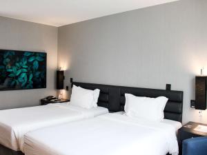 Postel nebo postele na pokoji v ubytování Grand Mercure Sao Paulo Vila Olimpia