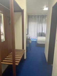 Postel nebo postele na pokoji v ubytování Hotel Am Flughafen