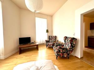 TV a/nebo společenská místnost v ubytování Ferienwohnungen-Traben-Trarbach