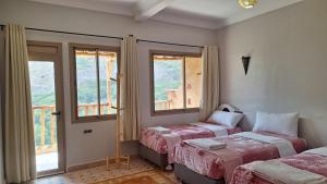 Postel nebo postele na pokoji v ubytování Atlas Berber Lodge