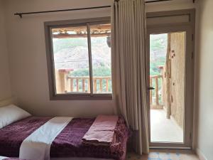 Postel nebo postele na pokoji v ubytování Atlas Berber Lodge