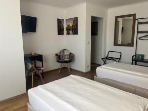 Postel nebo postele na pokoji v ubytování Hotel am Hafen