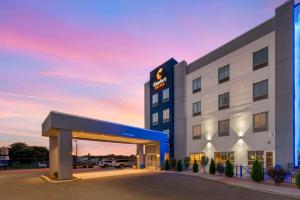 a rendering of a hotel with a lit up building at Comfort Suites Richmond East in Richmond