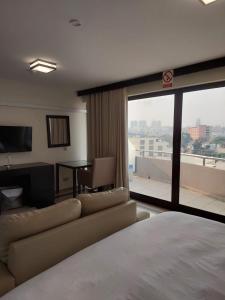 Postel nebo postele na pokoji v ubytování Lazúli Flats + 21 fotografií