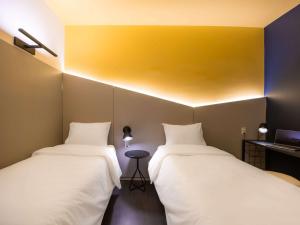 Postel nebo postele na pokoji v ubytování Ibis Styles Barretos