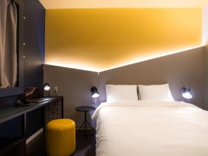 Postel nebo postele na pokoji v ubytování Ibis Styles Barretos