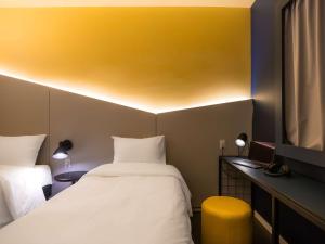 Postel nebo postele na pokoji v ubytování Ibis Styles Barretos