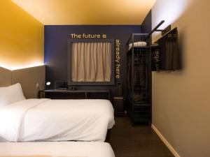 Postel nebo postele na pokoji v ubytování Ibis Styles Barretos
