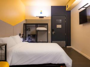 Postel nebo postele na pokoji v ubytování Ibis Styles Barretos