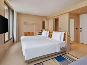 Hilton Garden Inn Rayong客房内的一张或多张床位