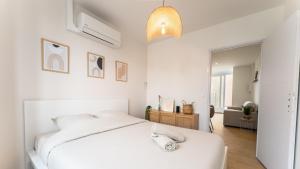 Postel nebo postele na pokoji v ubytování Villa Leone - Appart à 500m de la plage de Malo