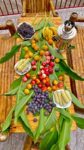 a table topped with lots of different types of fruits at PharphalInn in Batumi