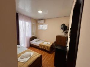 Postel nebo postele na pokoji v ubytování Imeri Hotel
