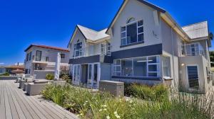 a house on the side of a street at House Susan Pardew Hersham in Great Brak River