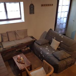 a living room with a couch and a table at Maison de montagne, vallée d'Ossau in Bielle +20 photos