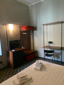 Postel nebo postele na pokoji v ubytování Santuzza Art Hotel Catania