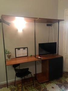 TV a/nebo společenská místnost v ubytování Santuzza Art Hotel Catania