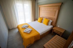 Posteľ alebo postele v izbe v ubytovaní ONAR by the sea Luxurious Apartments
