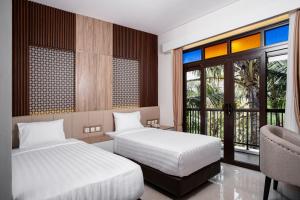 Letto o letti in una camera di The Amrta Borobudur