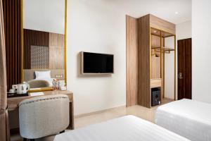Letto o letti in una camera di The Amrta Borobudur